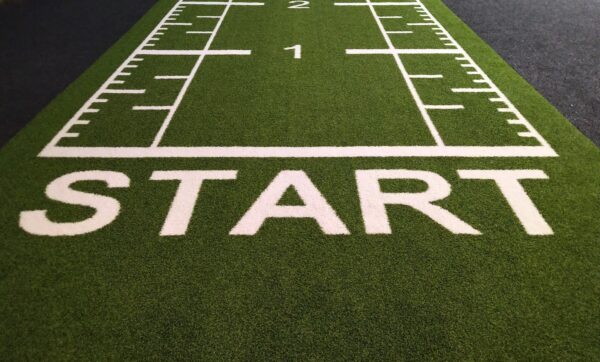 'Start' written in front of a green baize athletics track.